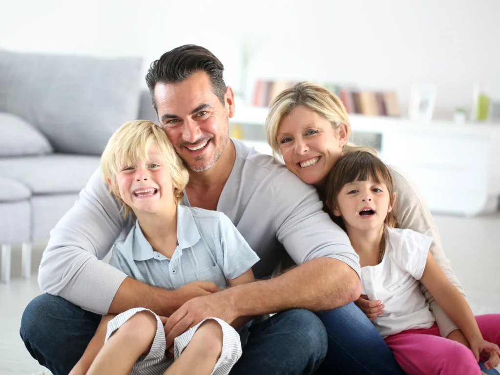 family smiling after family and cosmetic dentistry in Oakland, CA